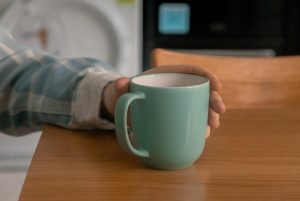 Hand holding cup